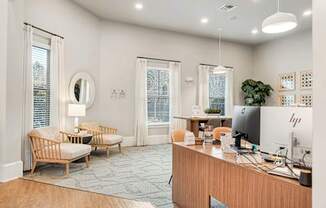 A modern home office with a wooden desk and a chair.