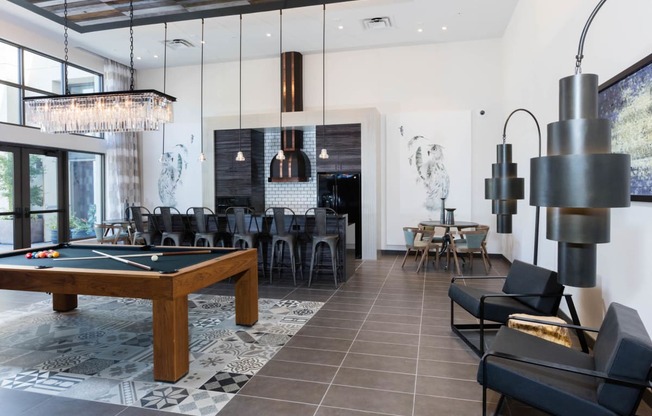 Pool table and kitchen area in newly renovated clubhouse at Aventine, California, 94547