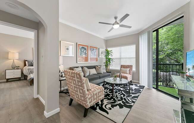 a living room with a couch and two chairs