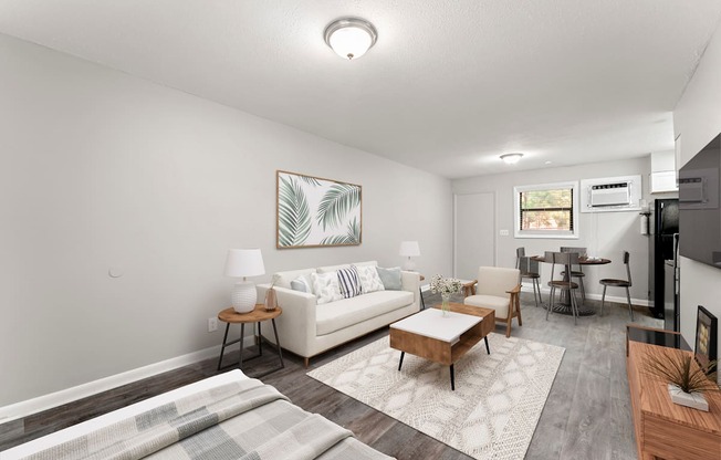 a living room with a white couch and a wooden coffee table  at Balfour 296, Lilburn, 30047