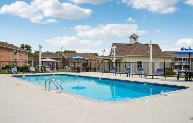 Resort-style swimming pool with sundeck at Reserve at Drakes Creek Apartments