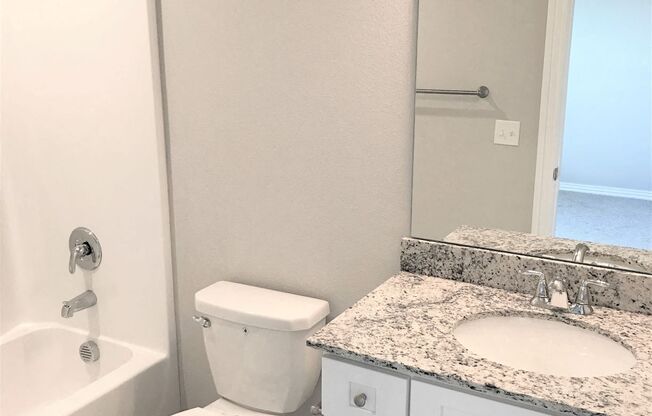 B3 (1-car) Guest Bath with granite countertops, sink, toilet, shower