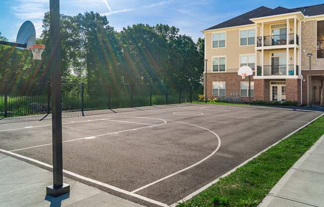 basketball court with building in background