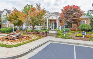 View of Leasing Office, Showing Parking, Entrance, and Landscaping at Summer Park Apartments