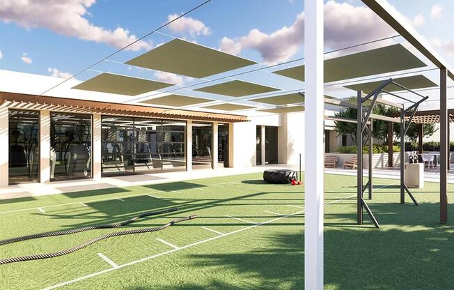 A modern building with a green lawn in front.