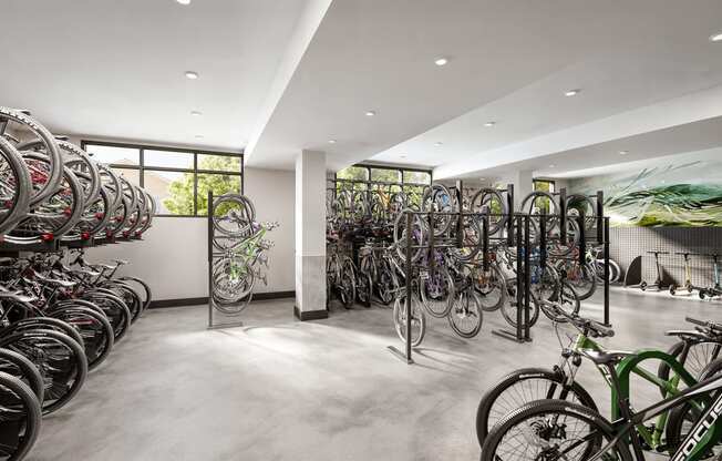 a large room filled with lots of bikes on display at Link Apartments® CYKEL Apartments, Charlotte , NC