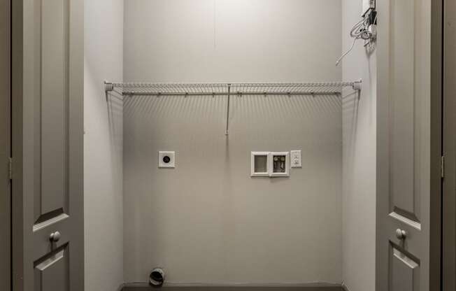 a white room with a shower in it and a white door