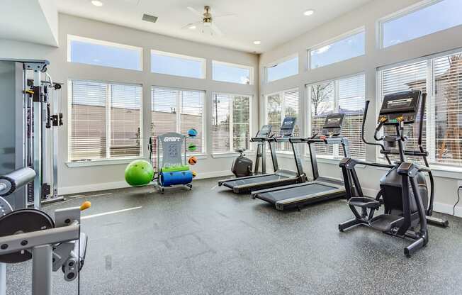 the gym at the enclave at woodbridge apartments in sugar land, tx