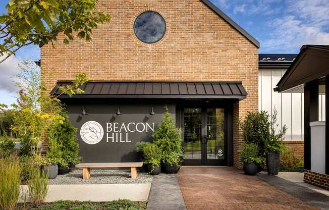 The front of a building with a sign that says Beacon Hill.