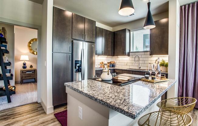 Grand Prairie Apartments for Rent - Kitchen With Stainless Steel Appliances, Sleek Cabinetry and Modern Finishes