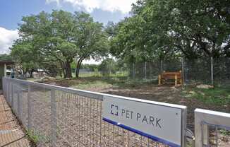 a dog park with a sign that reads c pet park