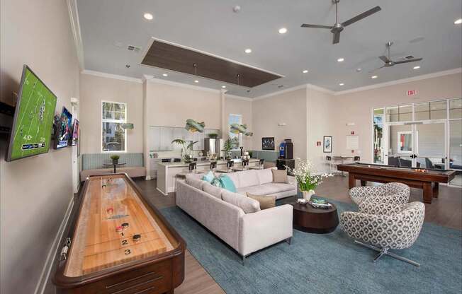 A room with a pool table and a couch.