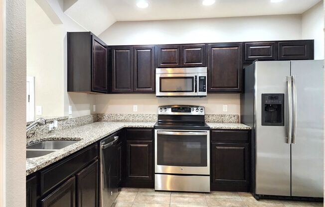 Beautiful Townhome; Open Floor Plan; New Paint; Garage; Private Patio; Stainless/Granite; Laundry