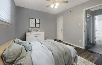 a bedroom with a bed and a ceiling fan at The Junction, Memphis