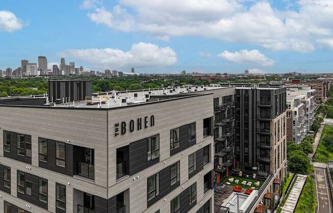 an aerial view of a large building with a city in the background at The Bohen Apartments , Minnesota, 55408