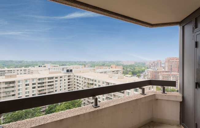 a balcony with a view of the city