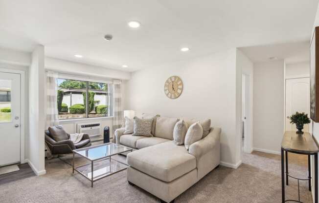 a spacious living room with a couch and a coffee table