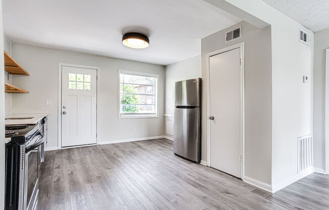 a kitchen and living room in a 555 waverly unit  at The Oasis on Cascade, Atlanta, GA, 30310