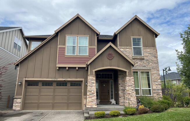Stylish 5-Bedroom Home with Modern Kitchen, Stone Fireplace & Luxurious Primary Suite