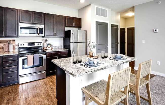 Luxury studio, one, and two bedroom apartment homes featuring granite countertops, stainless steel appliances, and fireplaces at East Lake Flats in Lincoln, NE