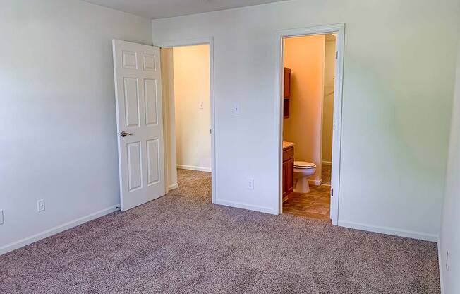 Spacious master bedroom with bathroom and walk-in closet at Bexley Village, Indiana, 46143