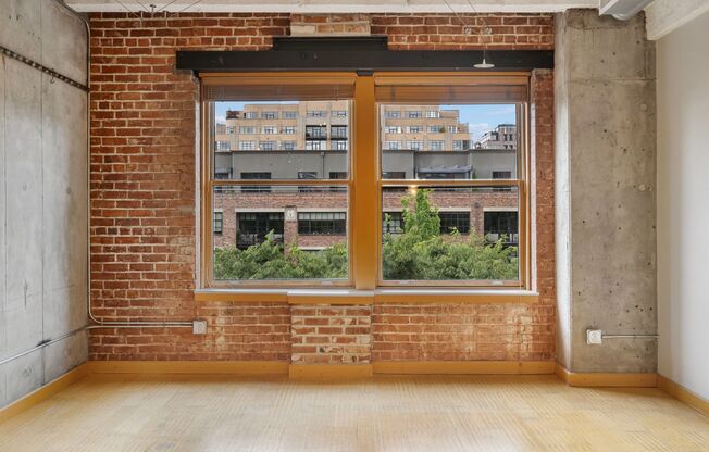 Historic Chown Pella Lofts - east facing studio w/parking/most utilities/rooftop deck