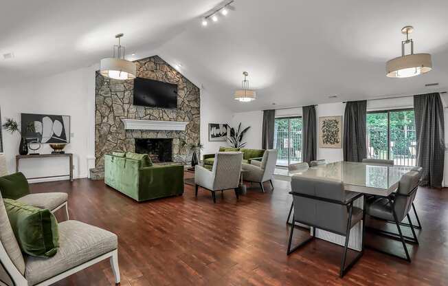 clubhouse lounge with sofas. tables, and seating with a fireplace in Greenwood