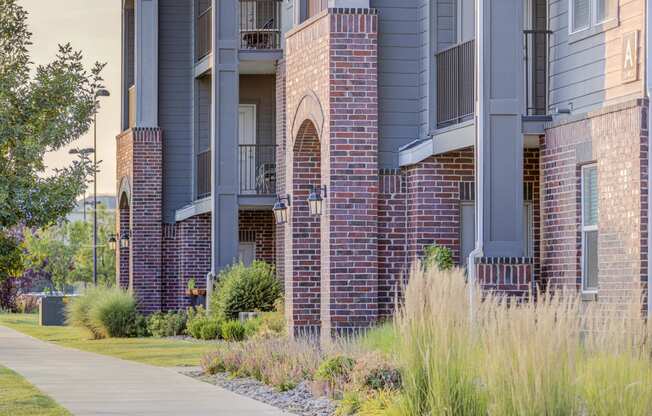 an exterior view of a building with a sidewalk