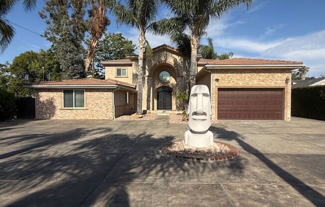 Gated estate with a backyard oasis