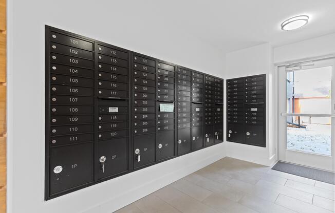 a lockers room in a house with white walls and a tile floor