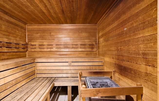 a wooden sauna with two benches and a table