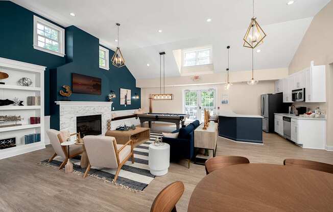 A modern kitchen with a dining table and chairs.