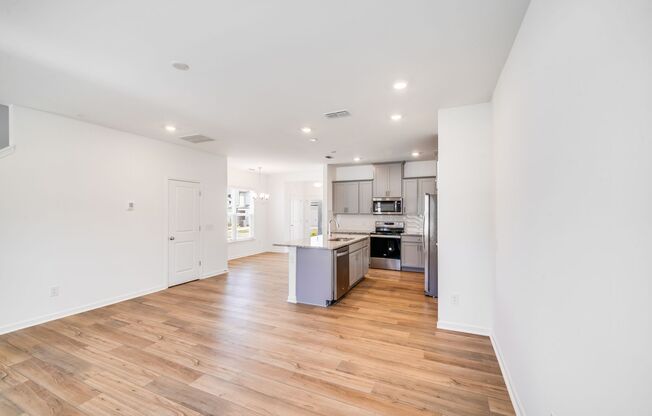 Brand-New End Unit Townhome in Riverstone – Designer Finishes & Future Resort-Style Amenities