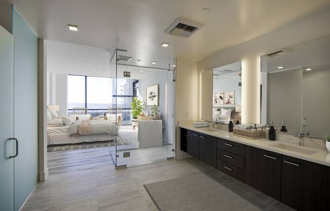 a bathroom with a large mirror and a sink and a shower