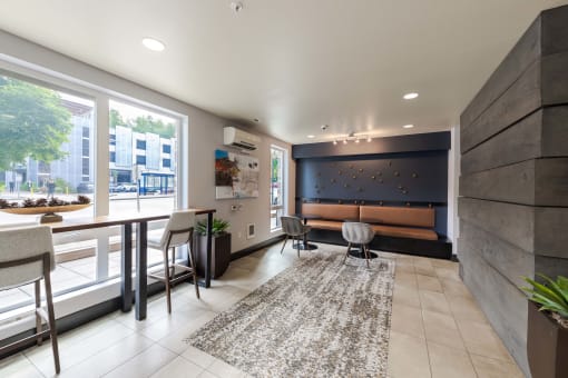 a living room with a tv and a table and chairs