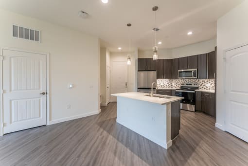 Spacious Full Size Kitchen with pendant lights at Residences at 3000 Bardin Road, Grand Prairie, TX, Texas, 75052