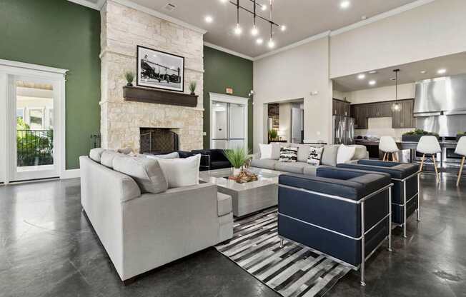 A modern living room with a fireplace and a large couch.