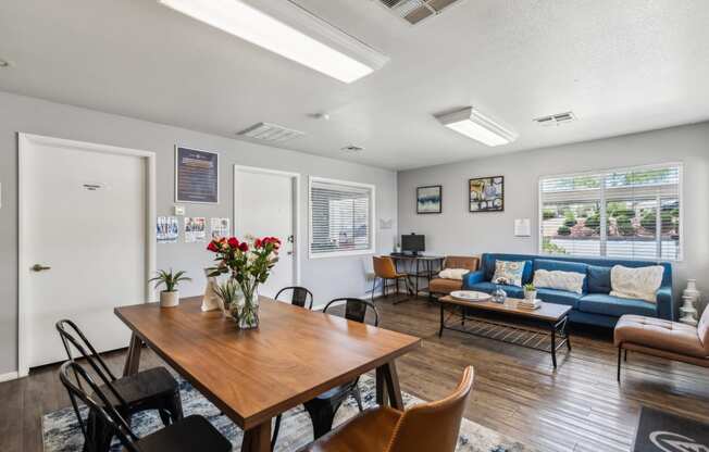 a living room with a dining room table and a couch