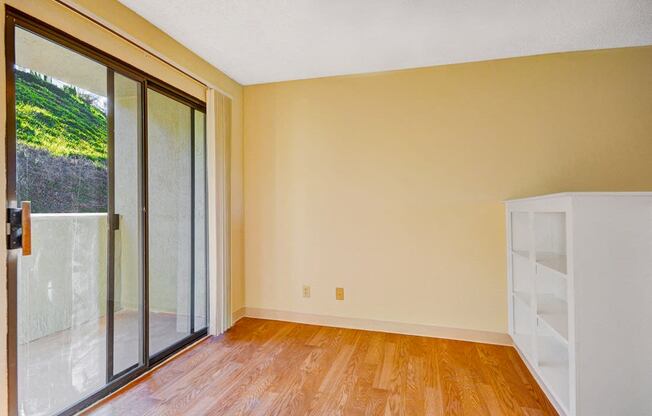 Vacant Apartment window and wooden floor  at Navajo Bluffs, San Diego, 92119