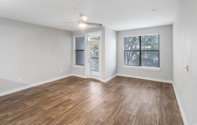 A room with wooden flooring and a ceiling fan. at West Inman Lofts, Georgia