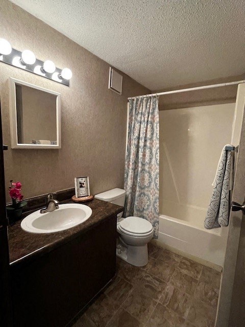 a bathroom with a toilet and a sink and a shower