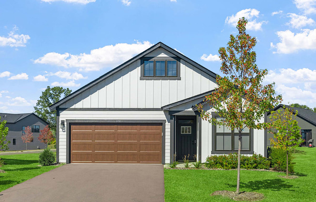 the front of a house with a garage door