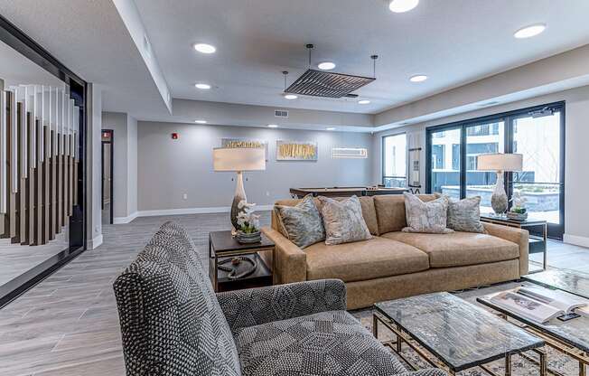 A living room with a couch, armchair, and coffee table.