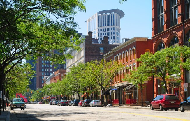 A city street with cars and buildings.
