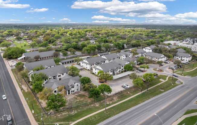 A suburban area with houses and a road.