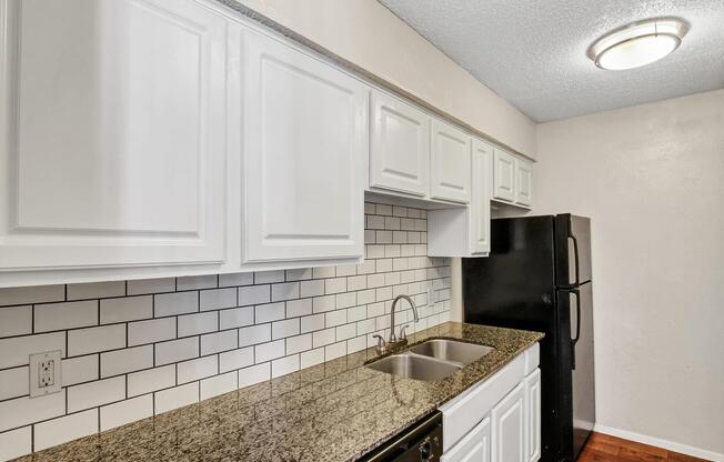 a kitchen with a stove and a sink