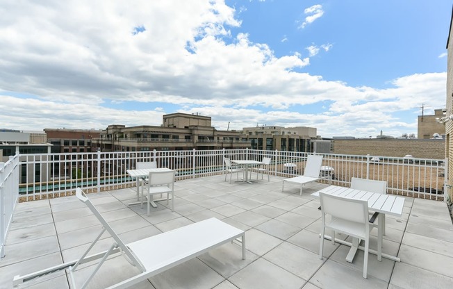 rooftop lounge with lounge chairs, social seating and tables at brunswick house apartments in dupont circle washington dc