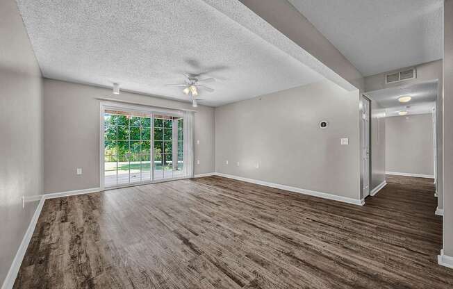 Spacious Living Area With Wood-Style Flooring