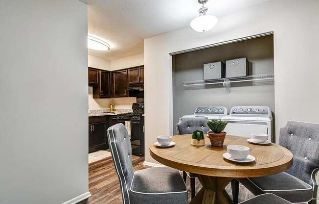 Dining room with in-unit laundry in a 1-bed, 1-bath apartment at Ashton Brook, featuring a functional space.