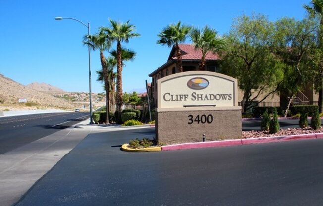 BEAUTIFUL CONDO IN A GATED COMMUNITY FEATURING PLANTATION SHUTTERS, TILE FLOORING AND NEW PAINT THROUGHOUT!